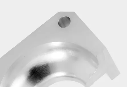 Close-up of a precision CNC machined aluminum pocket and mounting hole