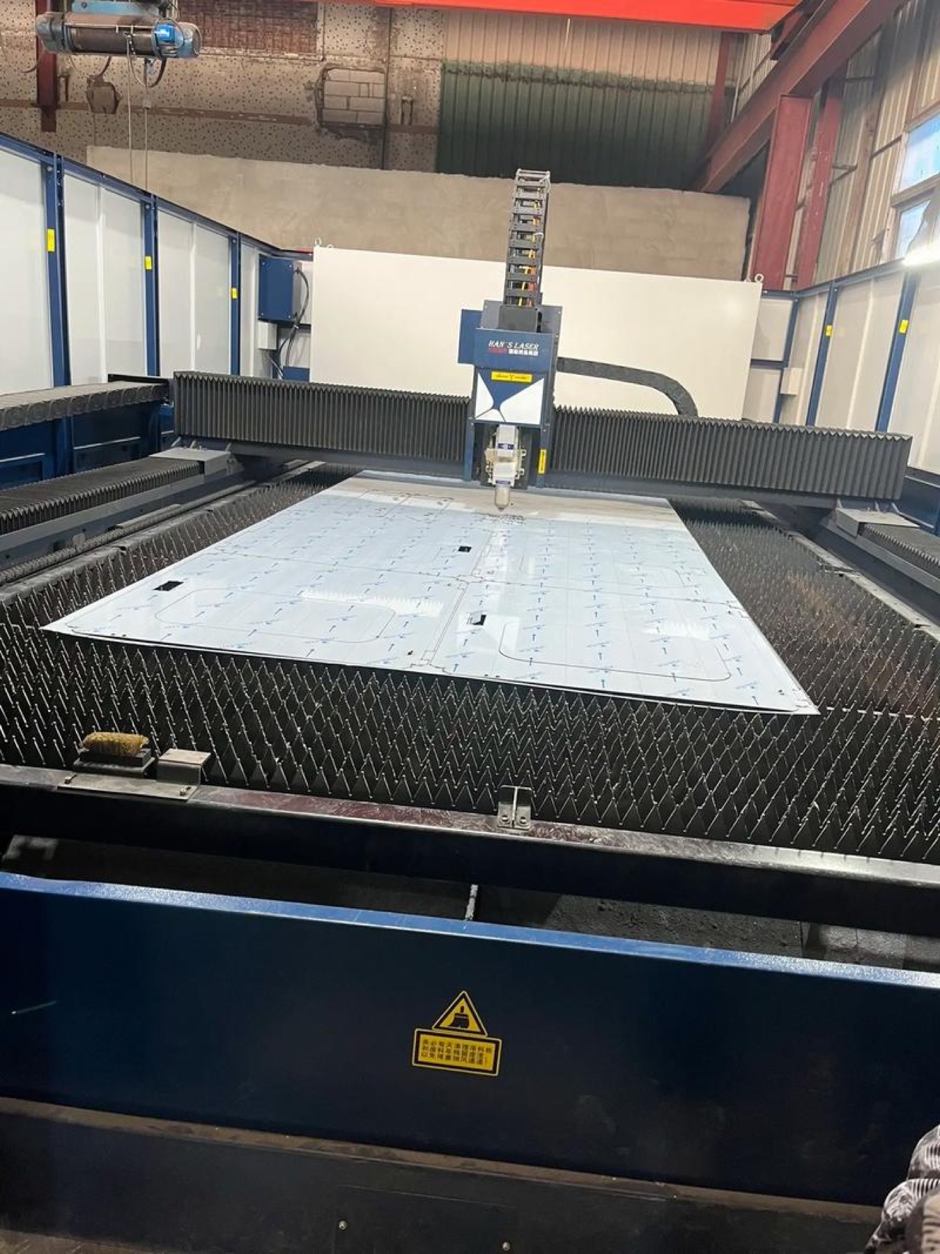 Laser cutting sheet metal profiles from a flat sheet