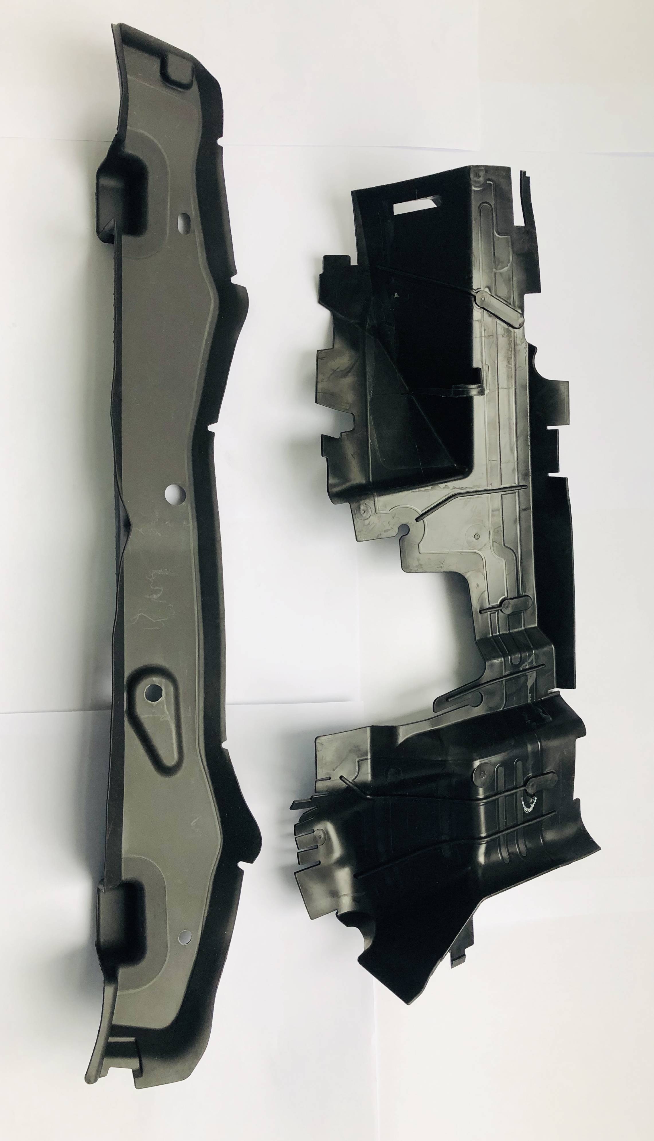Close-up of a large TPE and nylon PA overmolded automotive component
